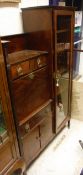 An early 20th Century mahogany secretaire cabinet with gallery top over two drawers and a fall