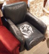 A modern black leather upholstered armchair in the Art Deco style