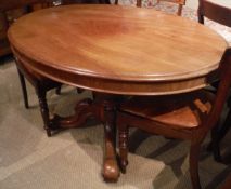 A late Victorian walnut oval loo table on centre pedestal to quadruped base