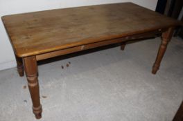 A rectangular pine kitchen table CONDITION REPORTS Measures approx 92 cm in depth x