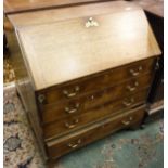 A George III oak bureau,