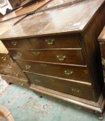An 18th Century oak chest on stand with applied moulded pediment over two over three graduated