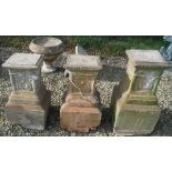 Three composite stone garden plinths