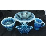 A collection of Fentons blue glass Uranium glass wares to include vases, baskets, bowls,