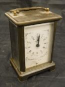 A brass cased carriage clock, the eight day movement by Ouverdrey et Bloquel,
