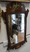 A 19th Century mahogany and parcel gilt hanging mirror with Hoho bird to the top and conch shell