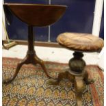 A 19th Century mahogany triple drop-leaf pedestal tea table on cabriole supports to pad feet,