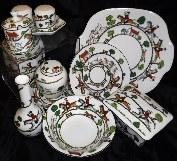 A Crown Staffordshire "Hunting Scene", part table ware to include four coffee cans, two sugar bowls,