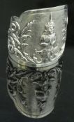 A Siamese sterling silver bangle with figural and foliate decoration, approx 2.