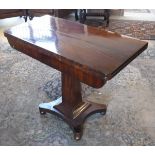 A 19th Century mahogany tea table, raised on square sectioned tapering column to quatrefoil base,