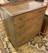 A 19th Century oak chest of four long drawers on bracket feet
