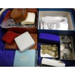 A white simulated leather vanity case containing various Coins of the Realm and foreign coinage