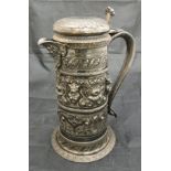 A 19th Century silver plated lidded ewer with embossed floral lion mask and fruit decoration of