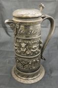 A 19th Century silver plated lidded ewer with embossed floral lion mask and fruit decoration of