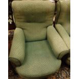 A pair of Victorian armchairs with curved front seats raised on ringed and turned front legs to