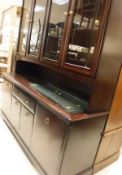 A Stag Minstrel mahogany dining room suite comprising a standing table,