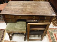 A late 19th Century oak five drawer dressing table,