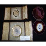 Three leather cased vintage tinted photographs,