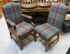 A set of six oak high backed dining chairs in the 18th Century taste with tartan upholstery,