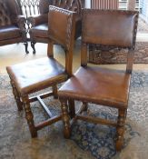 A set of seven leather and oak framed dining chairs on turned and ringed front legs to stretchered