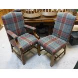 A set of six oak high backed dining chairs in the 18th Century taste with tartan upholstery,