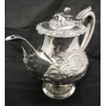 A Georgian silver teapot with later embossed decoration (London 1826 by Thomas Wilkes Baker),