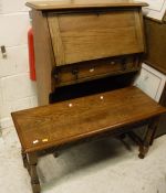 An oak student's bureau and oak stool on turned and carved supports