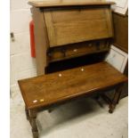 An oak student's bureau and oak stool on turned and carved supports