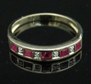 A 9 carat gold ruby and diamond half eternity ring CONDITION REPORTS Ring size is