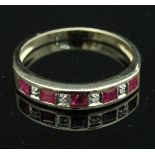 A 9 carat gold ruby and diamond half eternity ring CONDITION REPORTS Ring size is