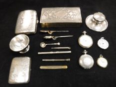 Assorted items to include two silver cigarette cases with scrolling foliate decoration,