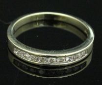 A 9 carat gold half eternity ring