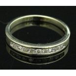 A 9 carat gold half eternity ring