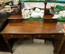 A late 19th Century walnut dressing table with mirrored super structure above the two drawers on