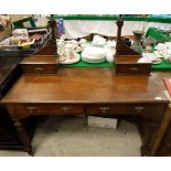 A late 19th Century walnut dressing table with mirrored super structure above the two drawers on
