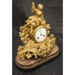 A 19th Century French gold painted spelter cased mantle clock,