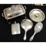 A silver backed and embossed dressing table brush and a silver backed dressing table mirror,