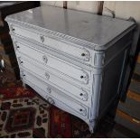 A white marble topped French commode of four long drawers with shaped apron,