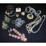 A large quantity of assorted costume jewellery to include bangles, bracelets,