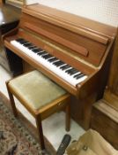 A modern sapele cased upright piano, the iron framed over strung movement by Bentley,