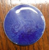A Ruskin Pottery blue glazed medallion (unmounted)