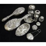 A collection of mixed silver dressing table items to include odd silver backed dressing table brush