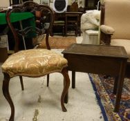 Four Victorian rosewood balloon back serpentine fronted dining chairs on cabriole front legs,