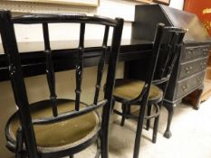 A black painted bureau of three drawers,