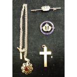 A quantity of 18 carat gold jewellery into include crucifix, brooch with pearl crown decoration,