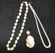 Two assorted pearl necklaces and a large pearl pendant