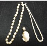 Two assorted pearl necklaces and a large pearl pendant