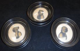 A collection of three 19th Century gold tinted silhouette portrait studies of two gentlemen and a