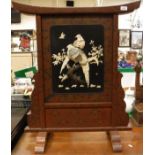 A Japanese lacquered fire screen,