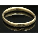 A yellow metal bangle, approx 10.